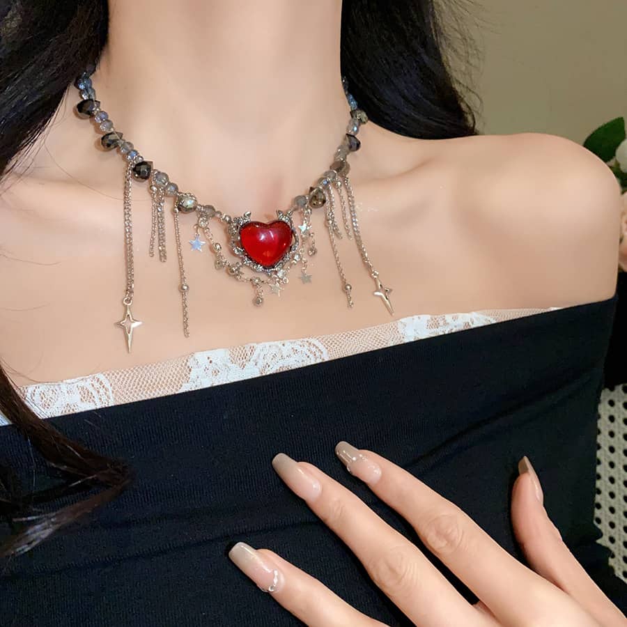 Punk heart fringe necklace with red heart charm and silver accents for edgy fashion lovers