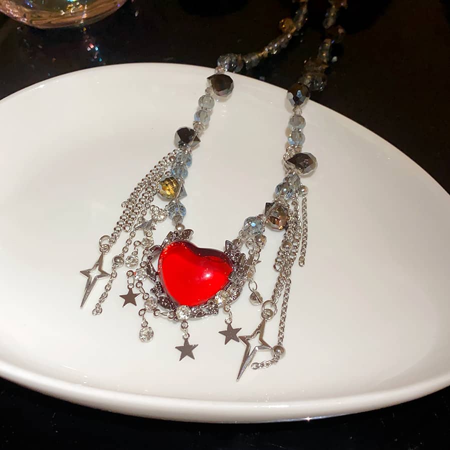 Punk heart fringe necklace with red heart pendant and silver chains, ideal for edgy fashion lovers