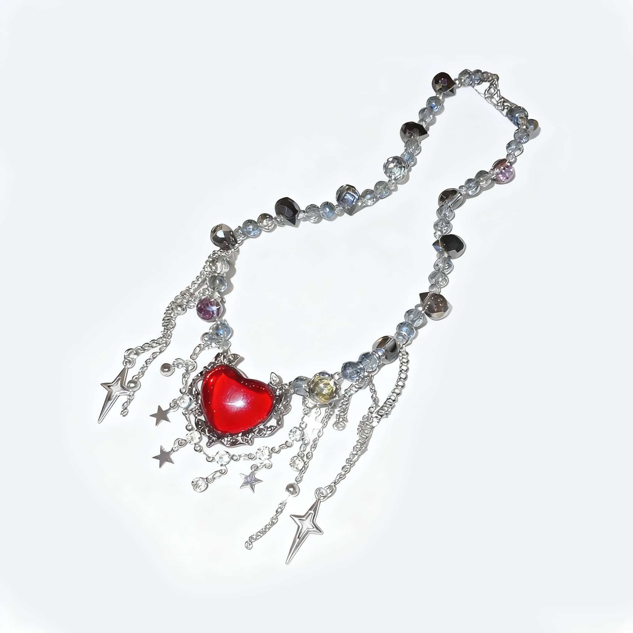 Punk heart fringe necklace with red heart pendant and silver star accents for a bold look