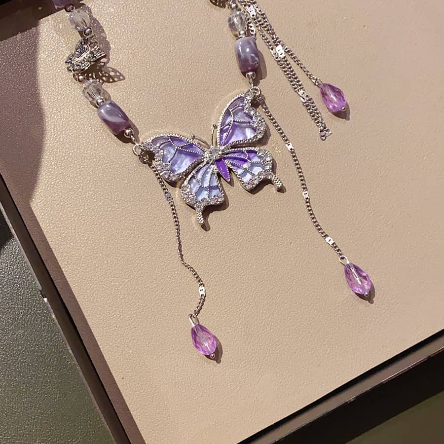 Beautiful purple butterfly necklace with sparkling accents and delicate chain details from 5 Senses