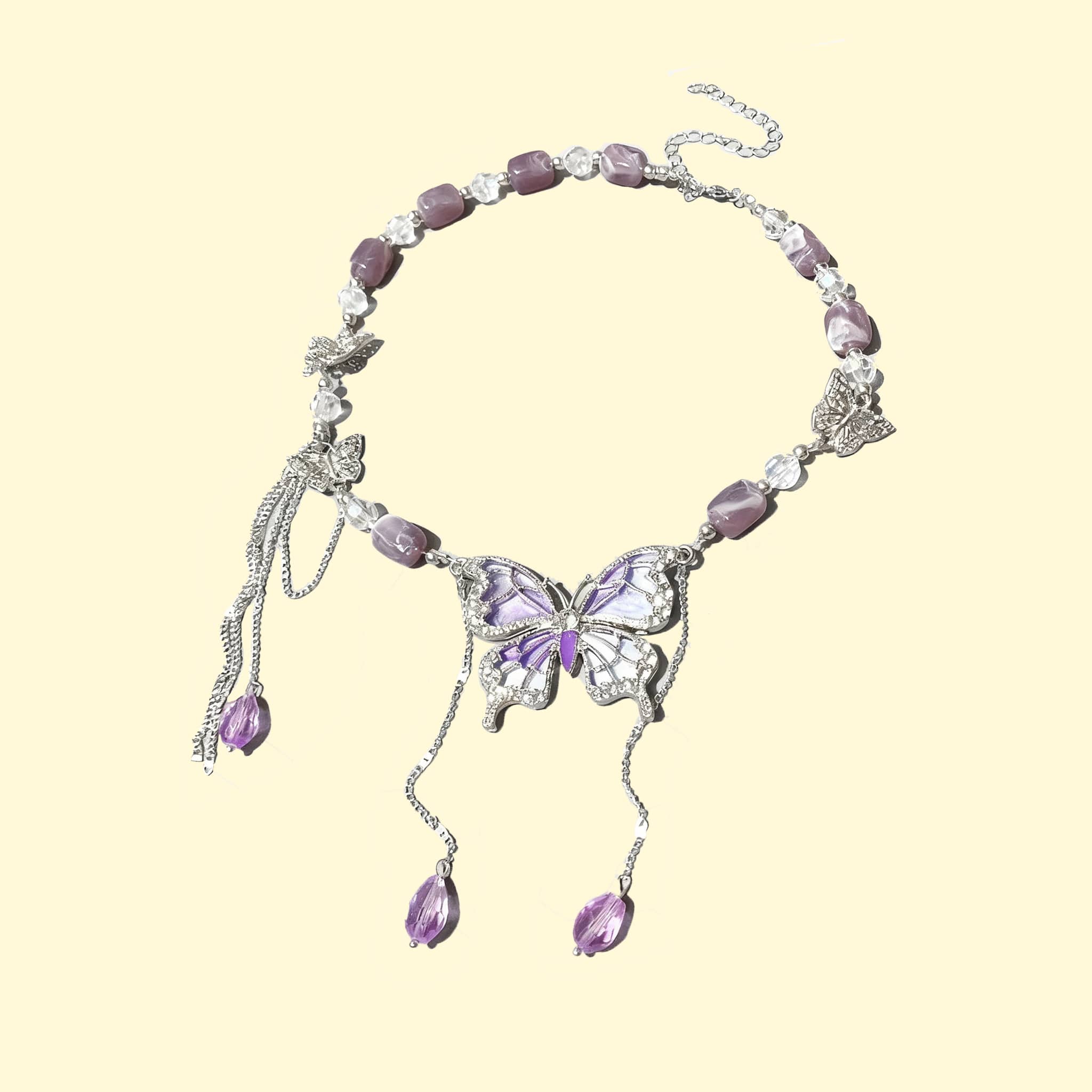 Purple butterfly necklace with intricate silver detailing and elegant gemstone accents