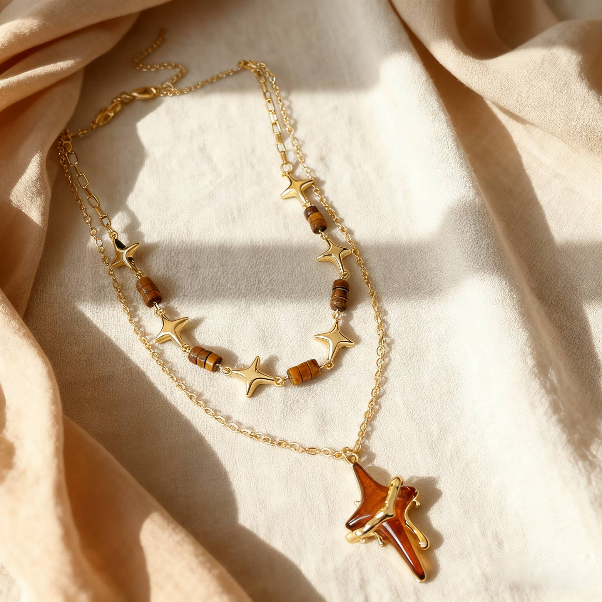 Angry necklace featuring a resin star pendant jewelry with gold accents and layered design