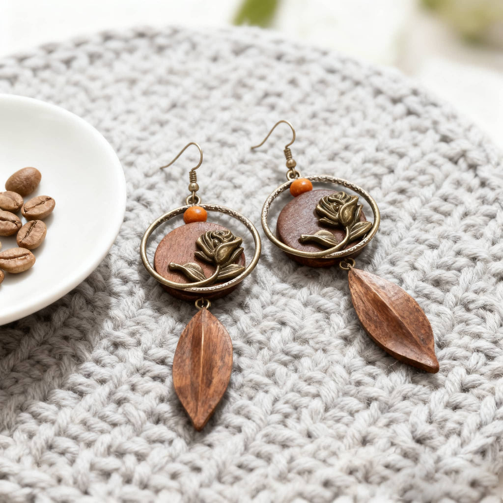 Vintage-inspired rose wood slice earrings with floral design and dangling leaves