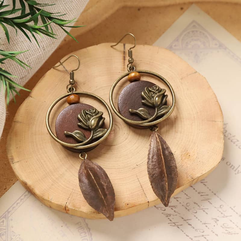 Angry rose wood slice earrings with bronze floral design and drop leaf accents for unique style