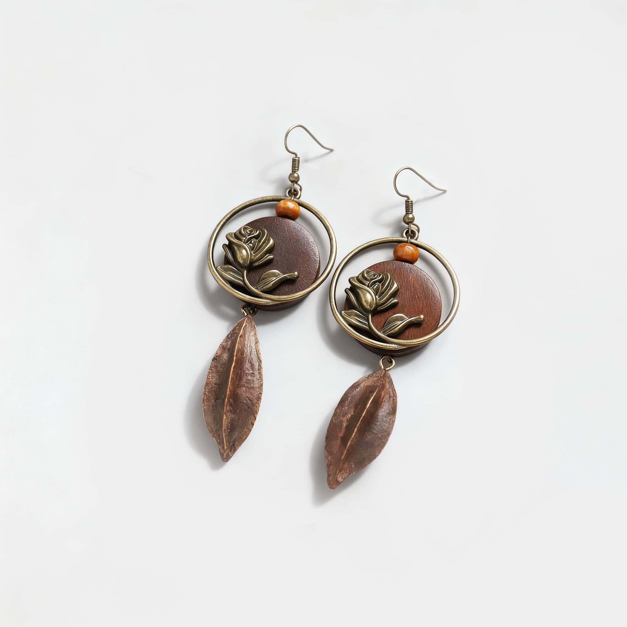 Angry rose wood slice earrings featuring floral design and elegant drop accents