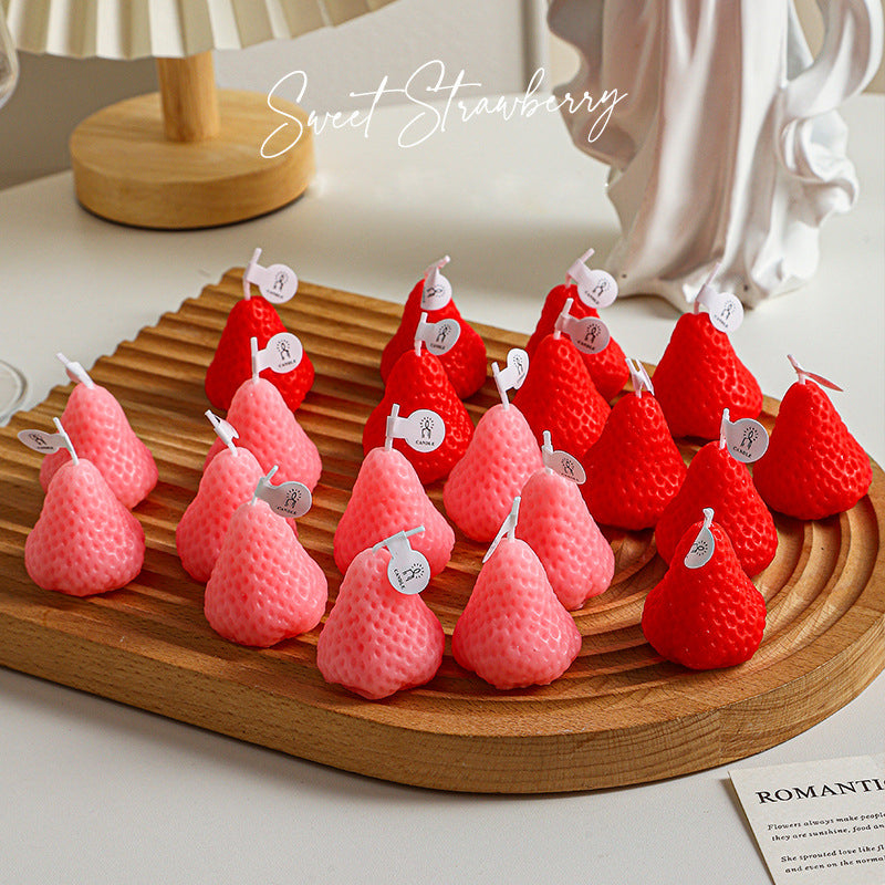 Sweet strawberry shaped self-love aromatherapy candle set in pink and red on wooden tray