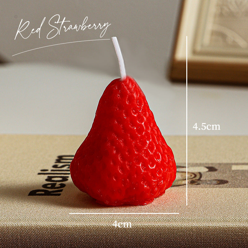 Red strawberry shaped self-love aromatherapy candle with wick and realistic texture