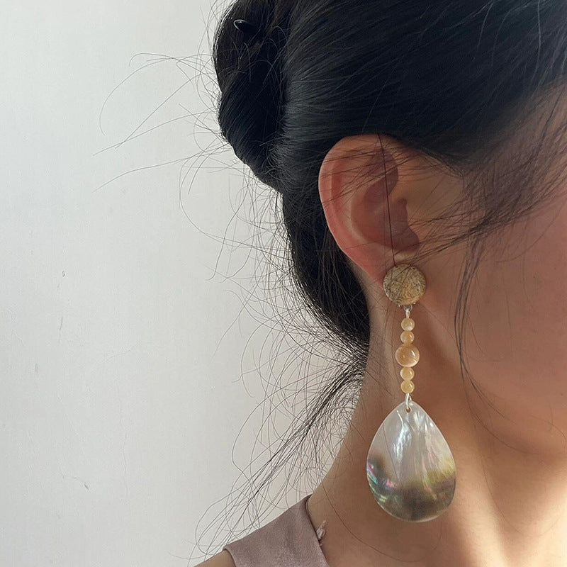 Elegant shell drop earrings for self care featuring iridescent design and delicate detailing