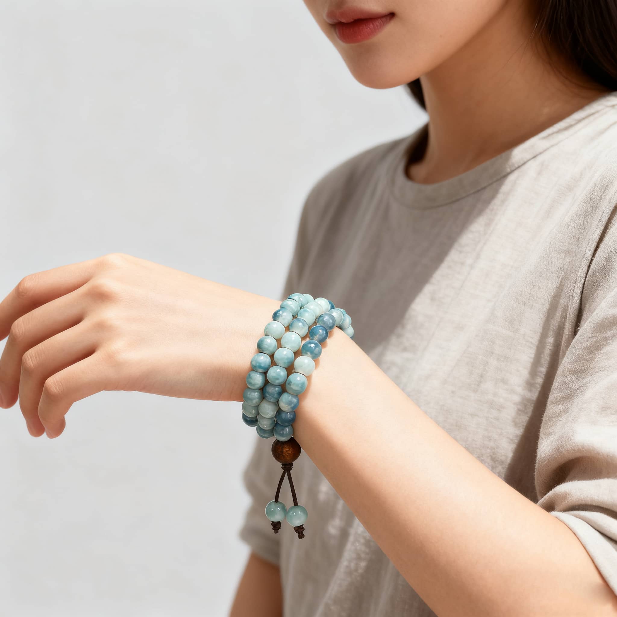 Stylish sky blue ceramic beaded bracelet worn on a woman's wrist for a chic look