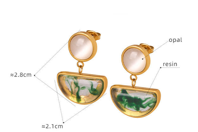 Gold and resin statement earrings for confidence with opal details and green swirl design