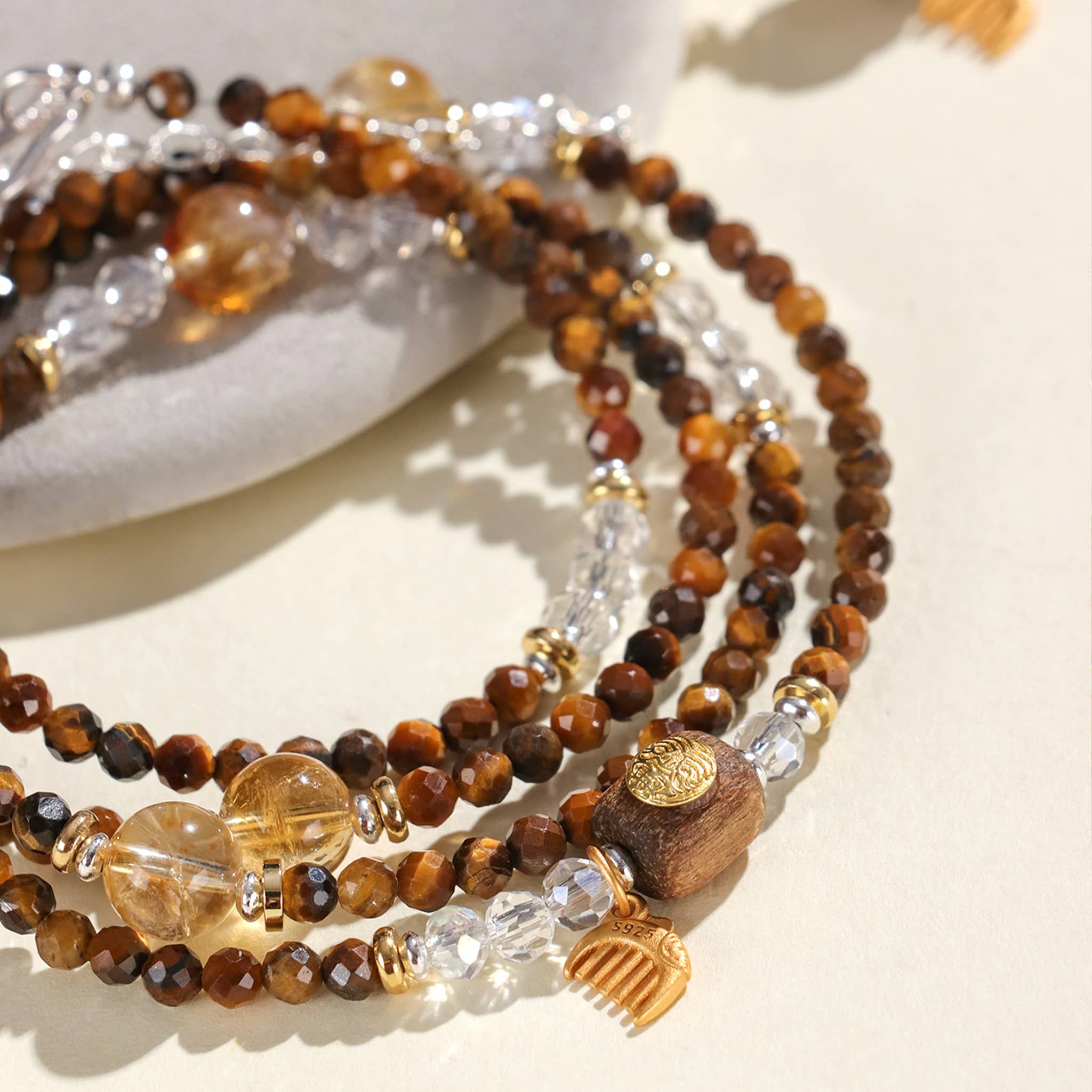 5 Senses tiger's eye anxiety bracelet with layered design featuring beads in brown and gold accents
