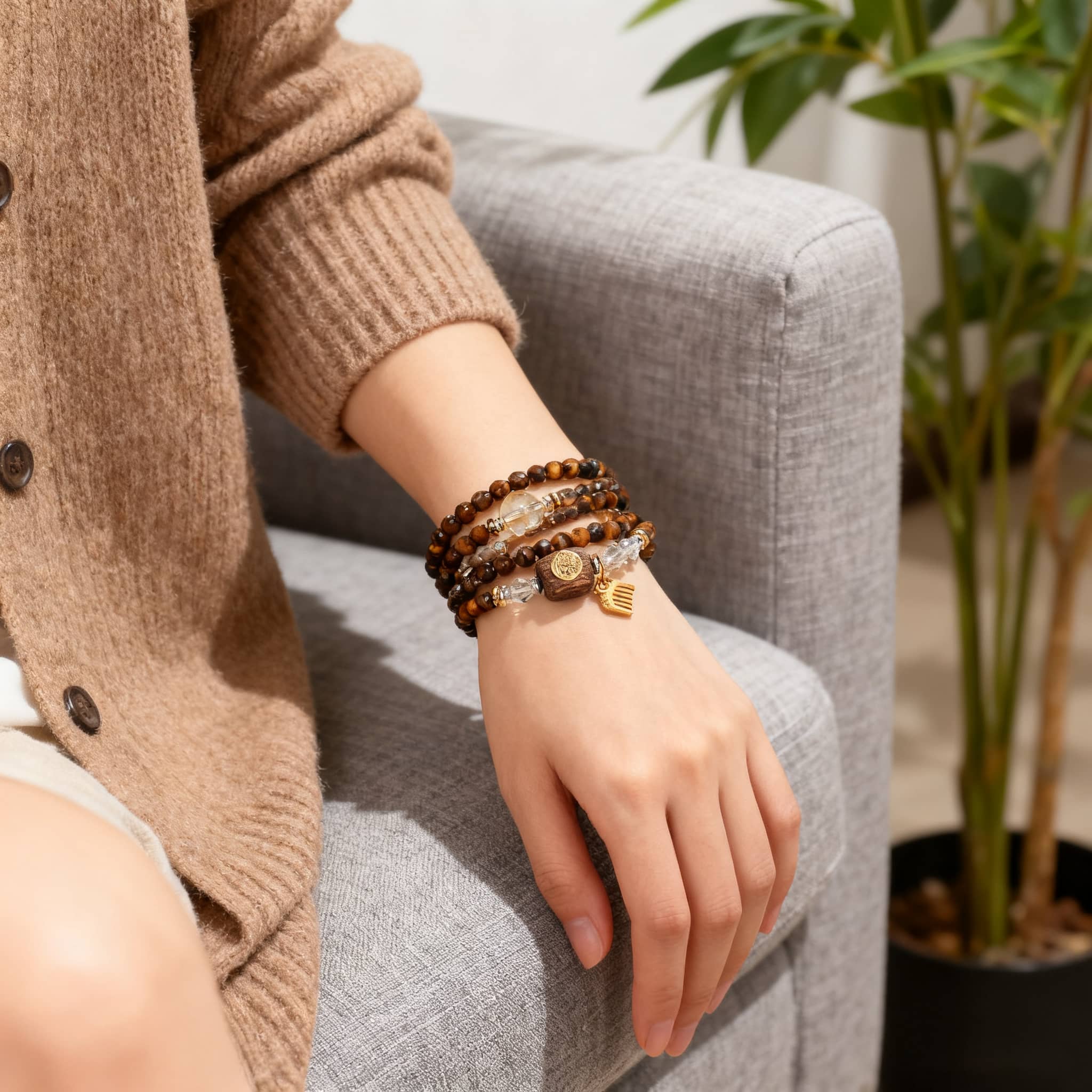 Anxious bracelet featuring tiger's eye anxiety bracelet worn with other beaded bracelets on a woman's wrist