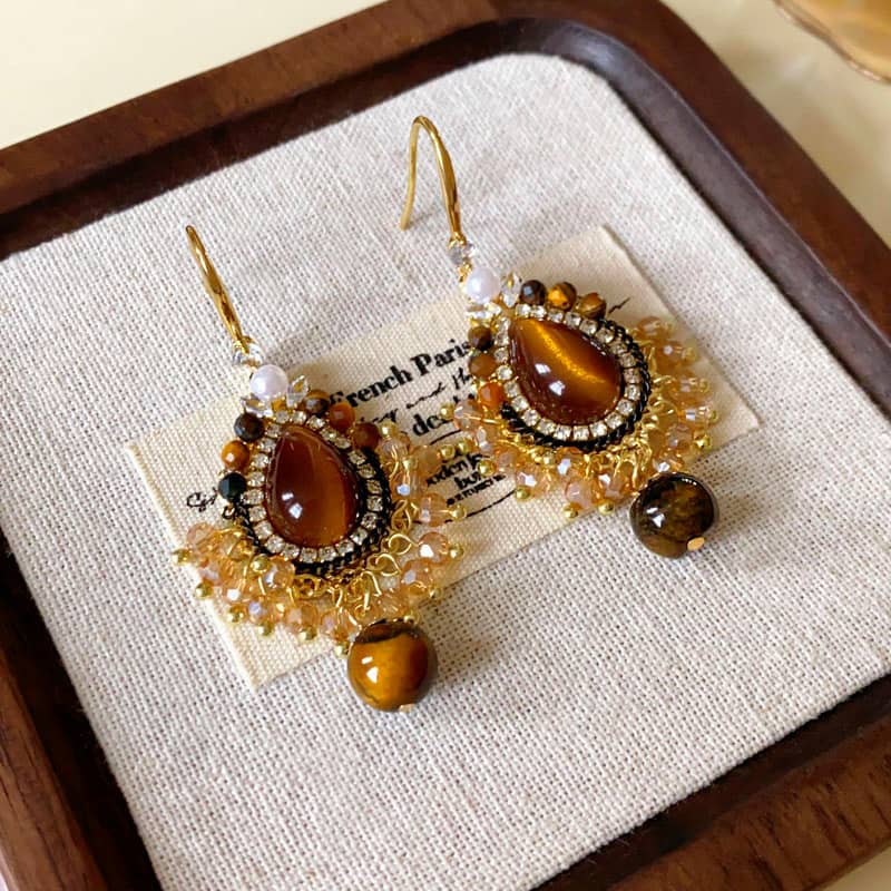 Beautiful tiger's eye anxiety relief earrings with gold accents and intricate beadwork for calming style