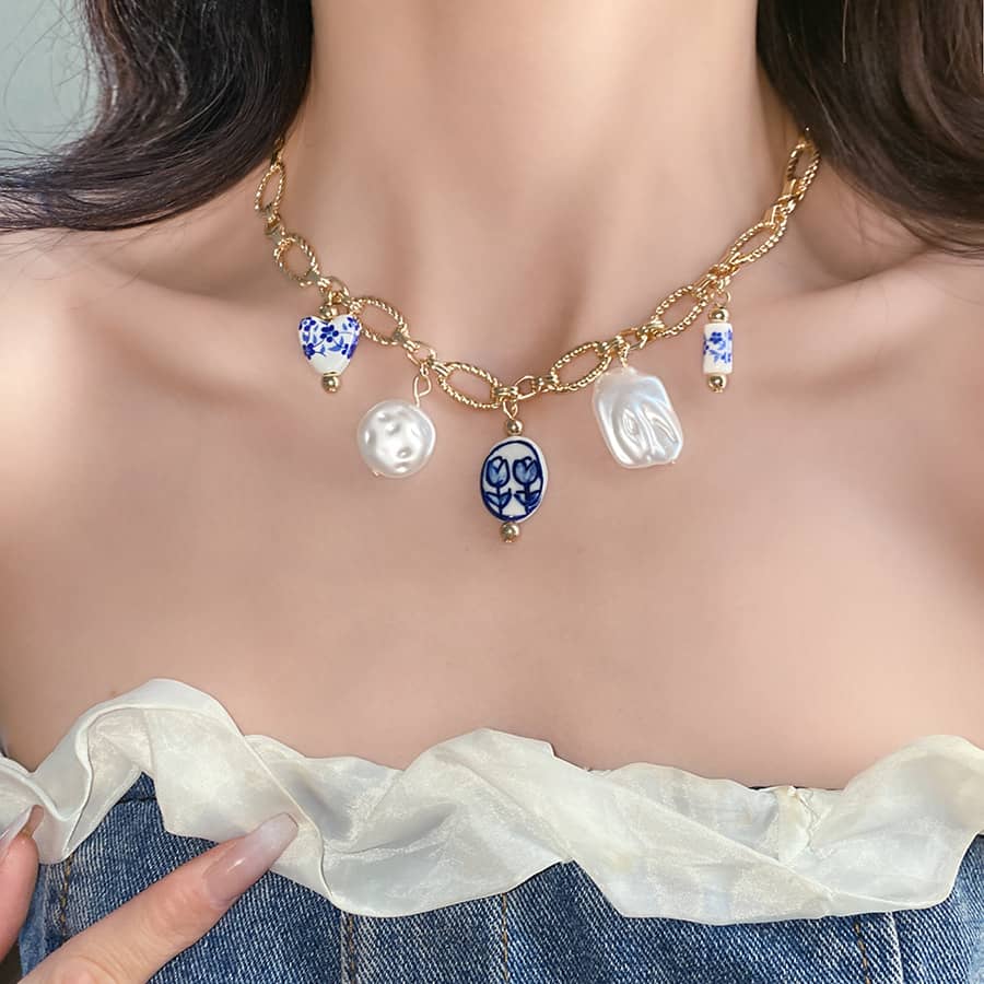 Calm Necklace by 5 Senses with pearl and blue decorative charms, a unique meaningful gift for women