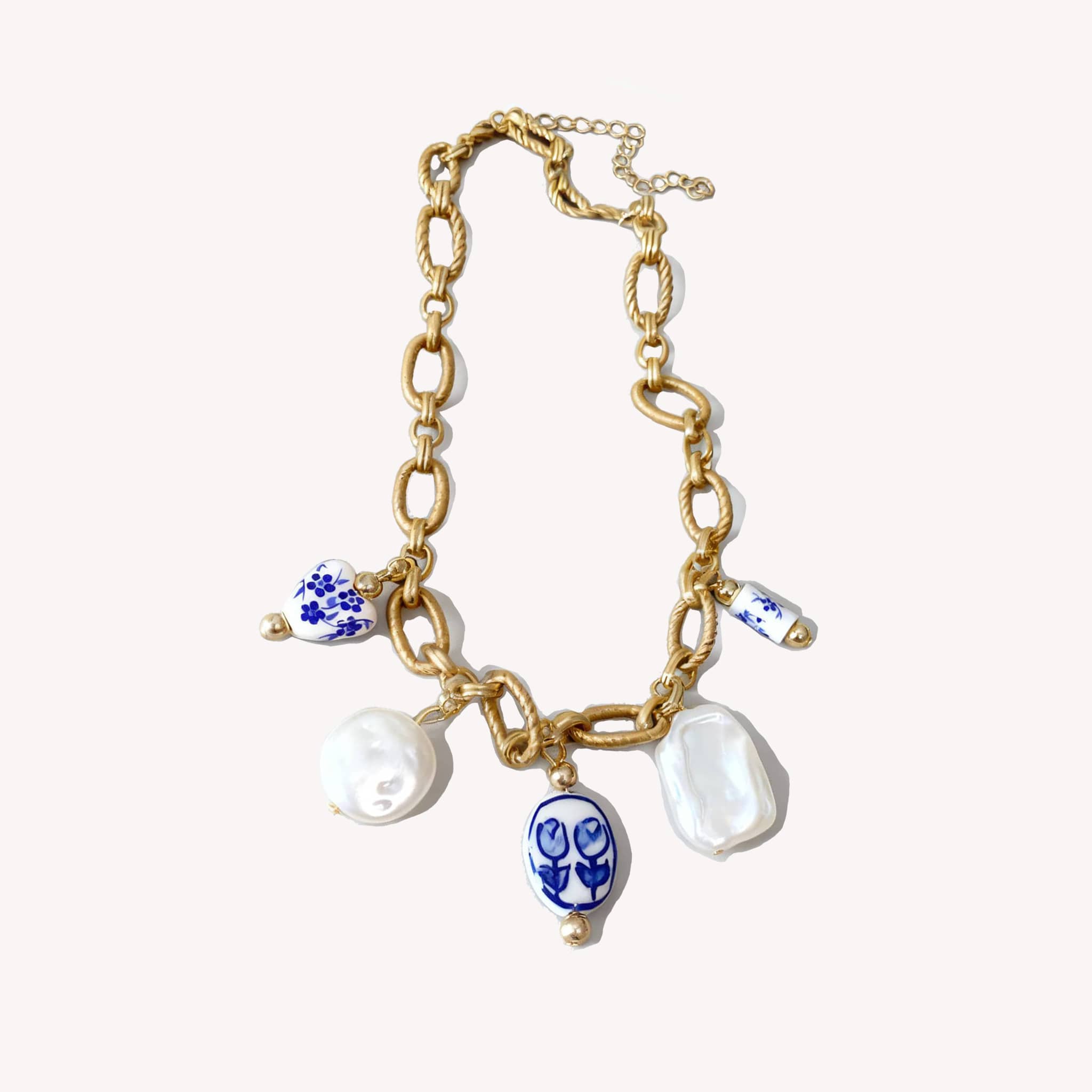 Unique necklace with gold chain and ceramic charms, a unique meaningful gift for women.