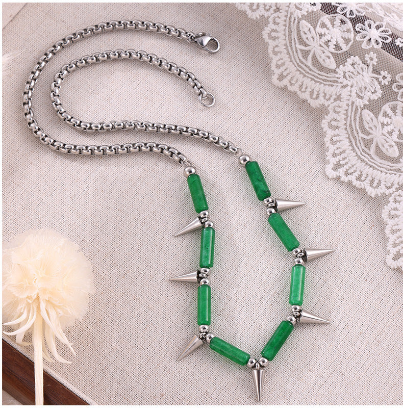 Anxious steel point necklace with green beads and silver spikes on a silver chain