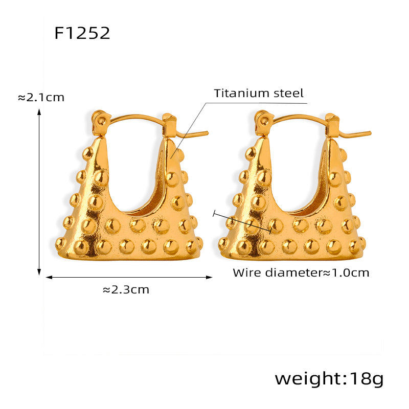 Geometric gold earrings made of titanium steel with dotted texture and unique shape