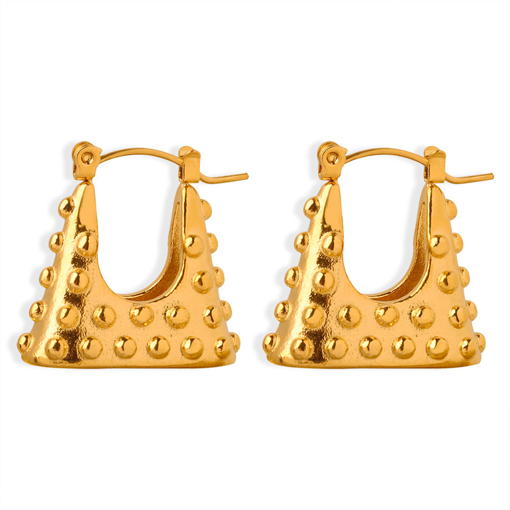 Geometric gold earrings with textured studded design and bold triangular shape