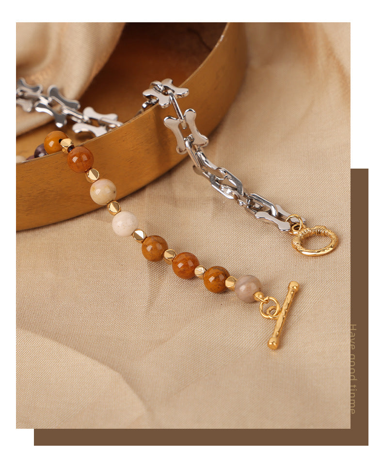 Mixed metal bead choker necklace featuring silver chain links and brown and beige beads with gold clasp
