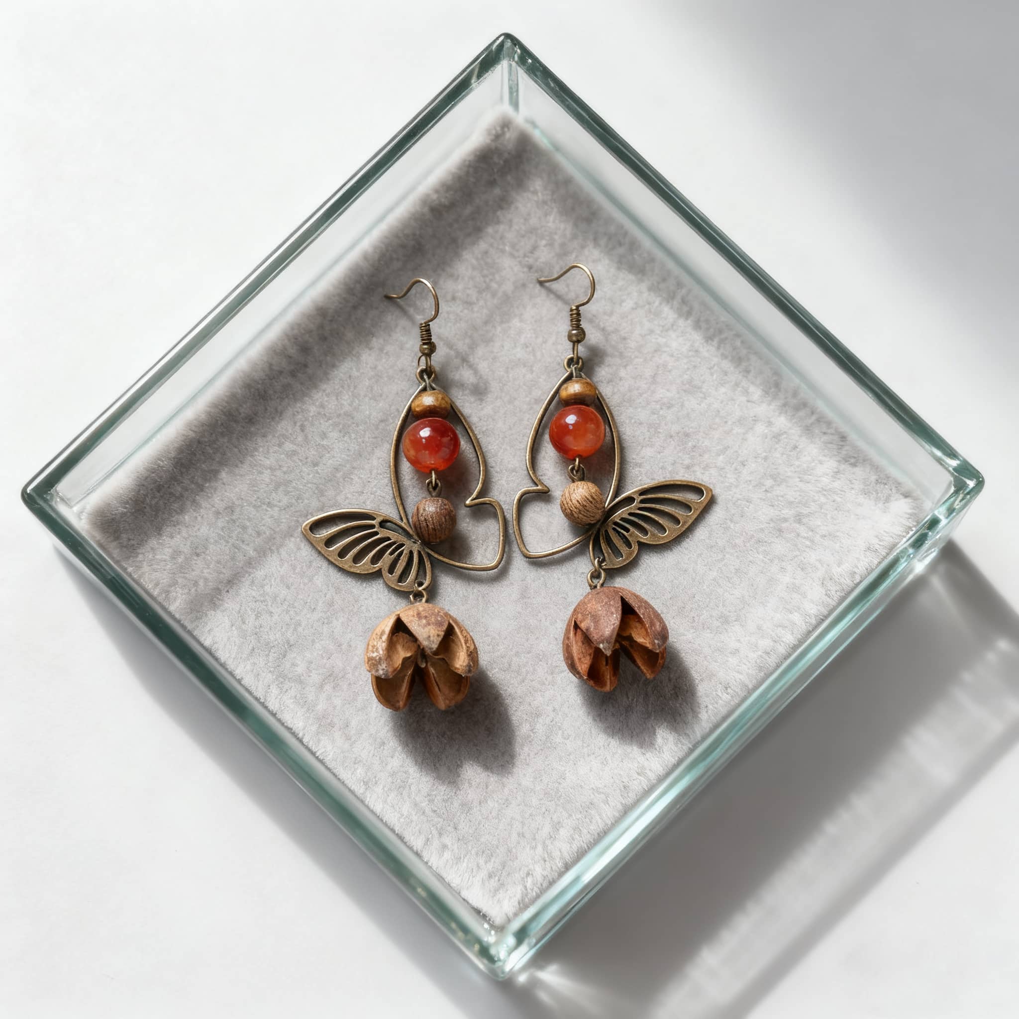 Vintage butterfly earrings featuring metal and wooden elements in a stylish design