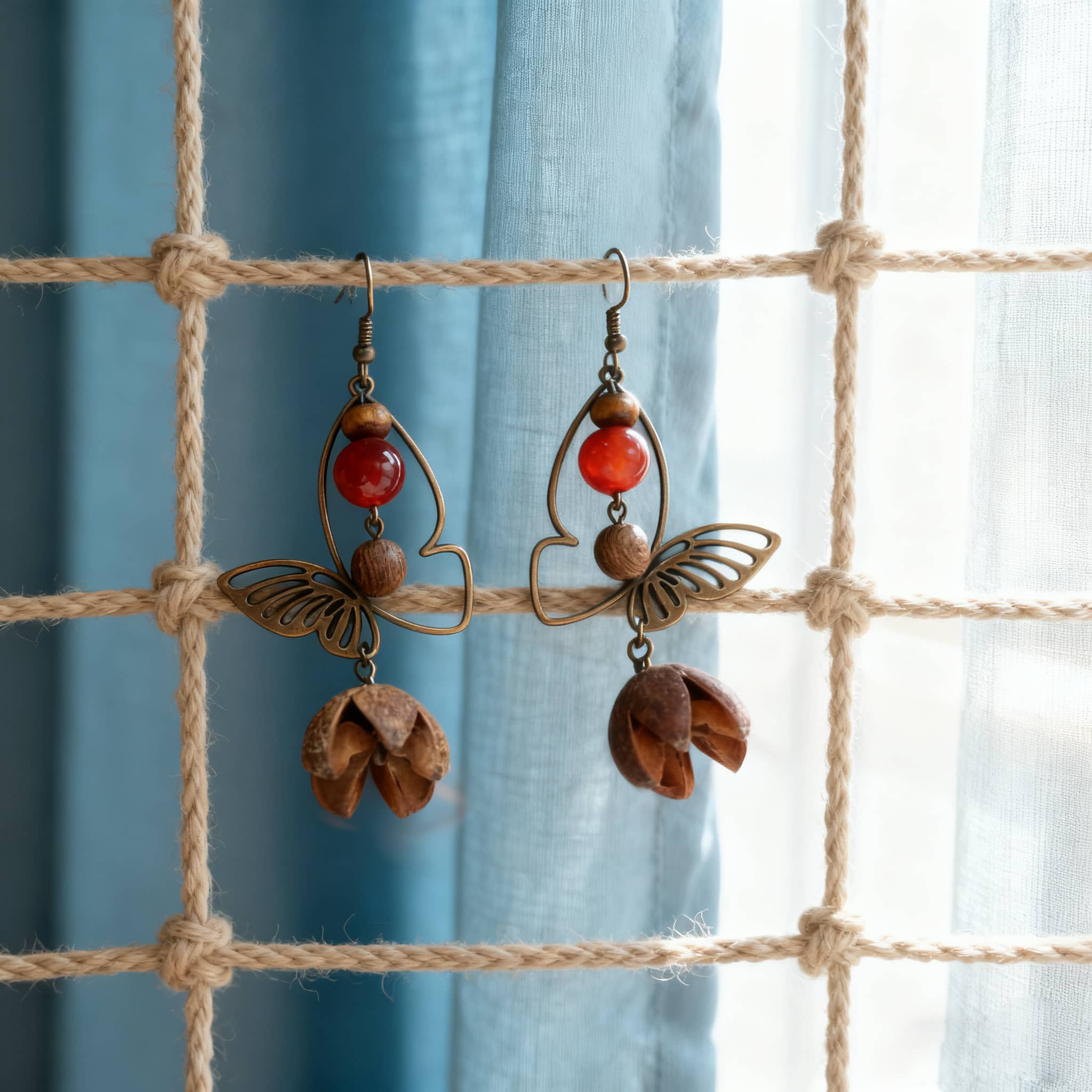 Unique vintage butterfly earrings with decorative beads and a whimsical design