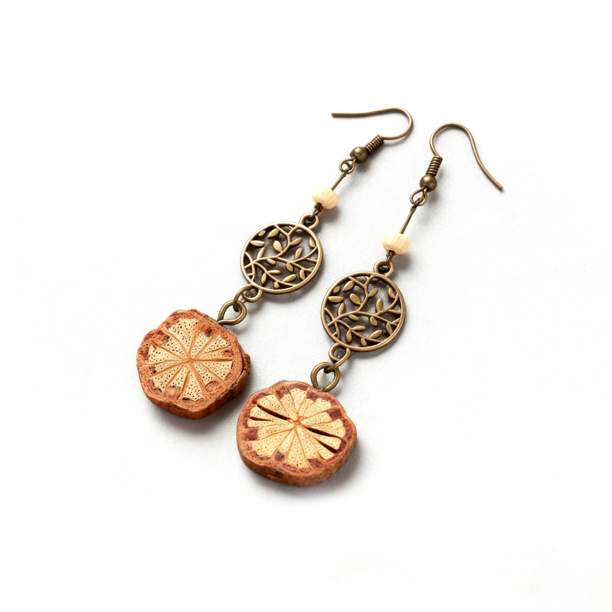 Vintage vine earrings featuring intricate designs with natural wood and metal accents