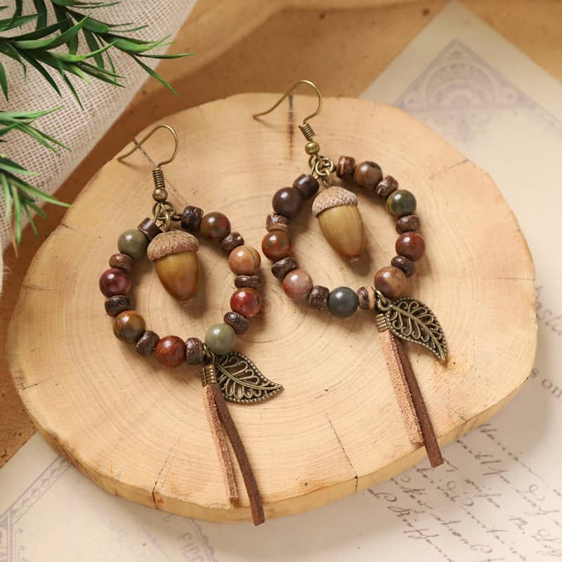 Vintage wood bead earrings with acorn accents and leaf design, perfect for a natural look