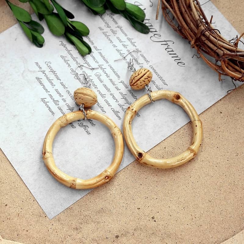 Calm walnut and bamboo earrings featuring a classic hoop design with wood accents