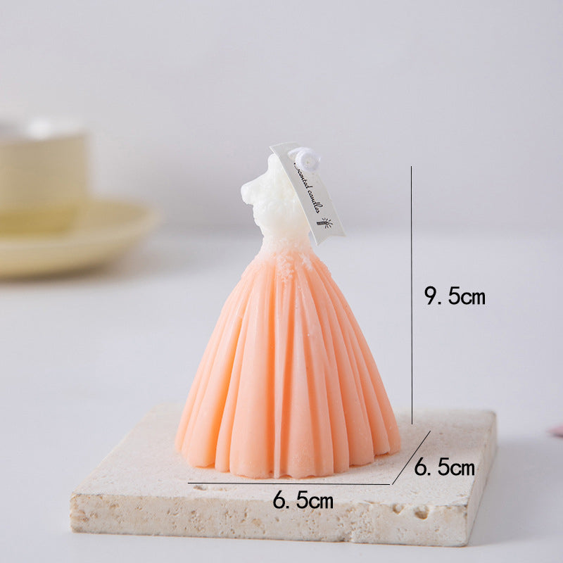 Elegant peach and white wedding dress candle measuring 9.5 cm tall and 6.5 cm wide