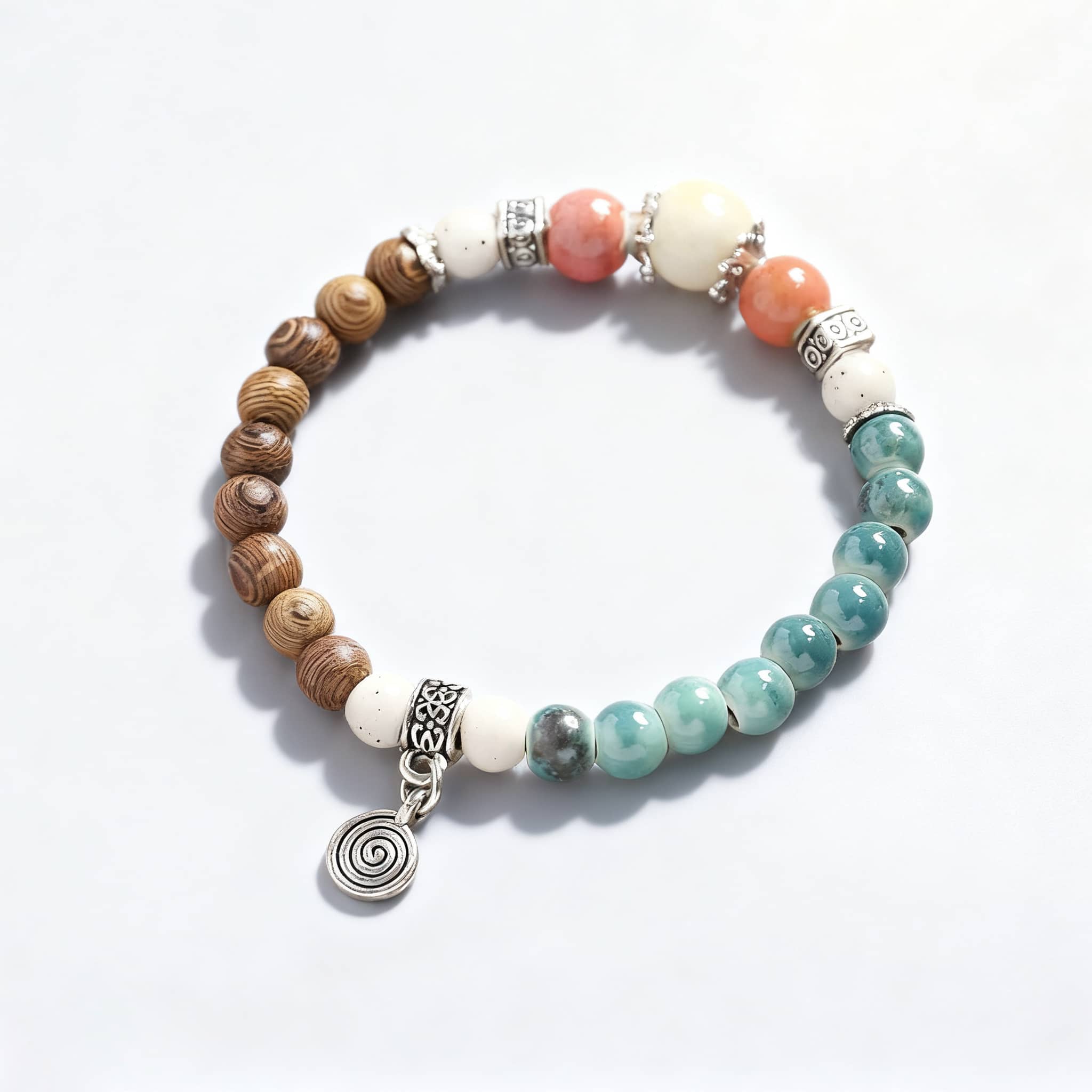 5 Senses wood and ceramic mindful bracelet featuring natural beads and a decorative charm