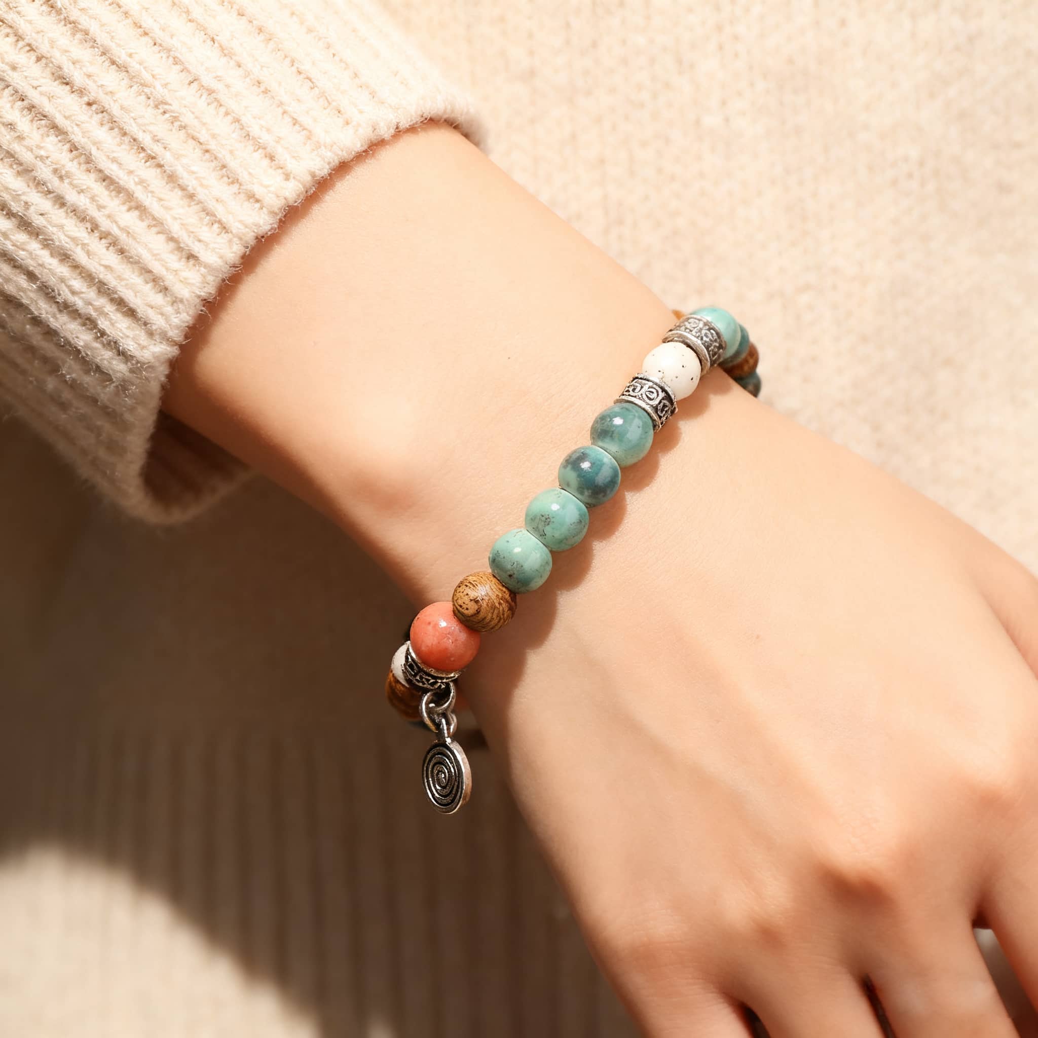 5 Senses wood and ceramic mindful bracelet featuring butterfly design with purple and white beads