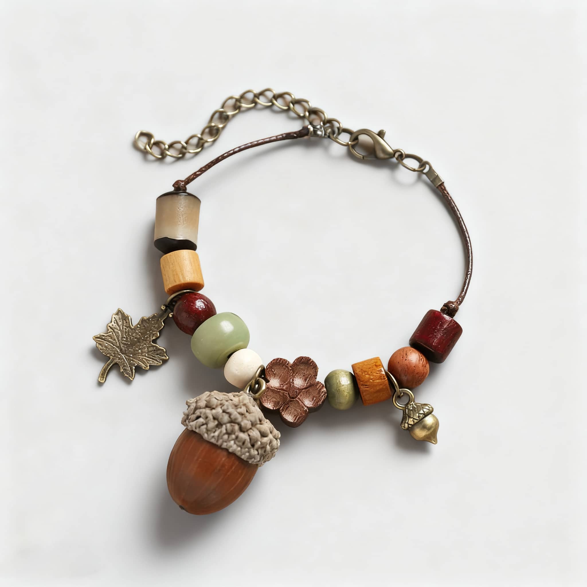 Handcrafted wood bead acorn bracelet featuring colorful beads and nature-inspired charms