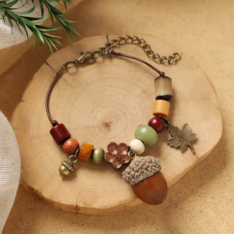 Handcrafted wood bead acorn bracelet featuring colorful wooden beads and a charming acorn centerpiece
