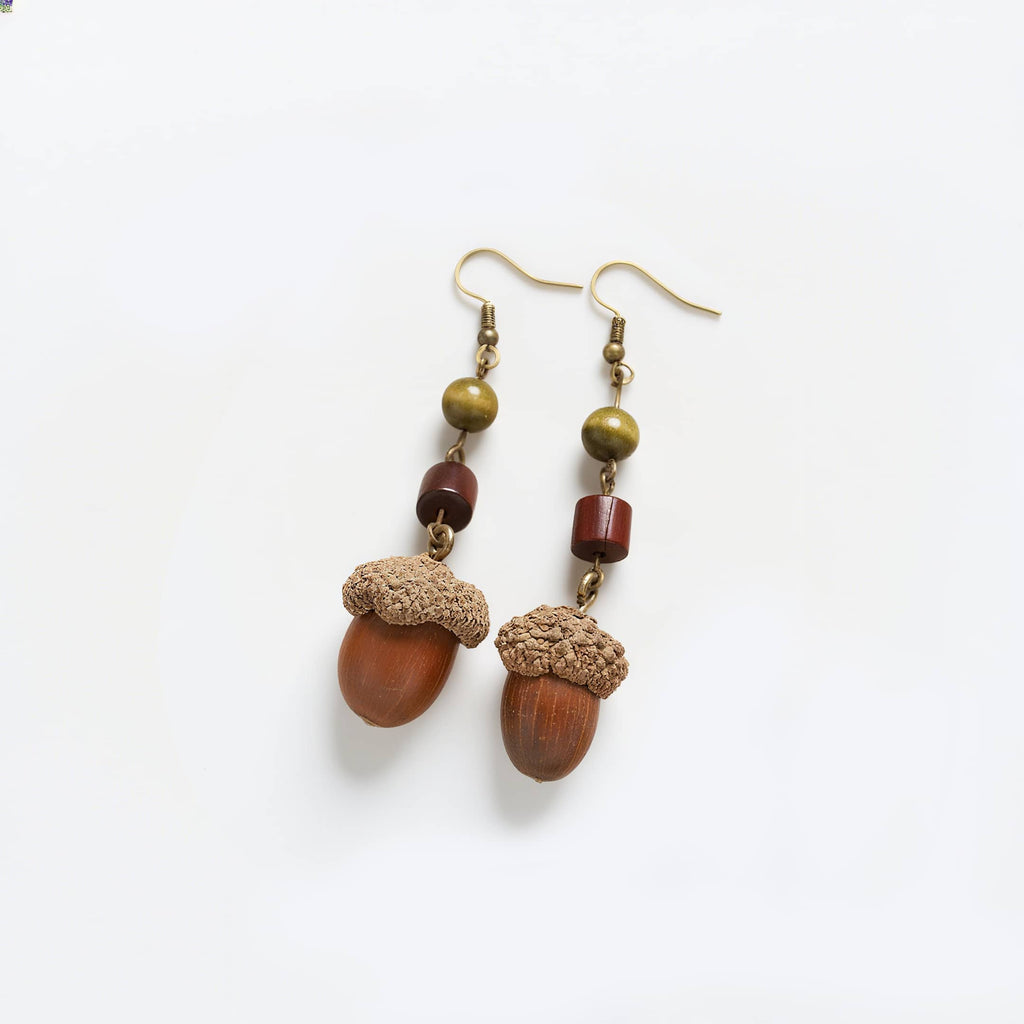 Handcrafted wooden acorn earrings with natural textures and earthy colors for a unique accessory