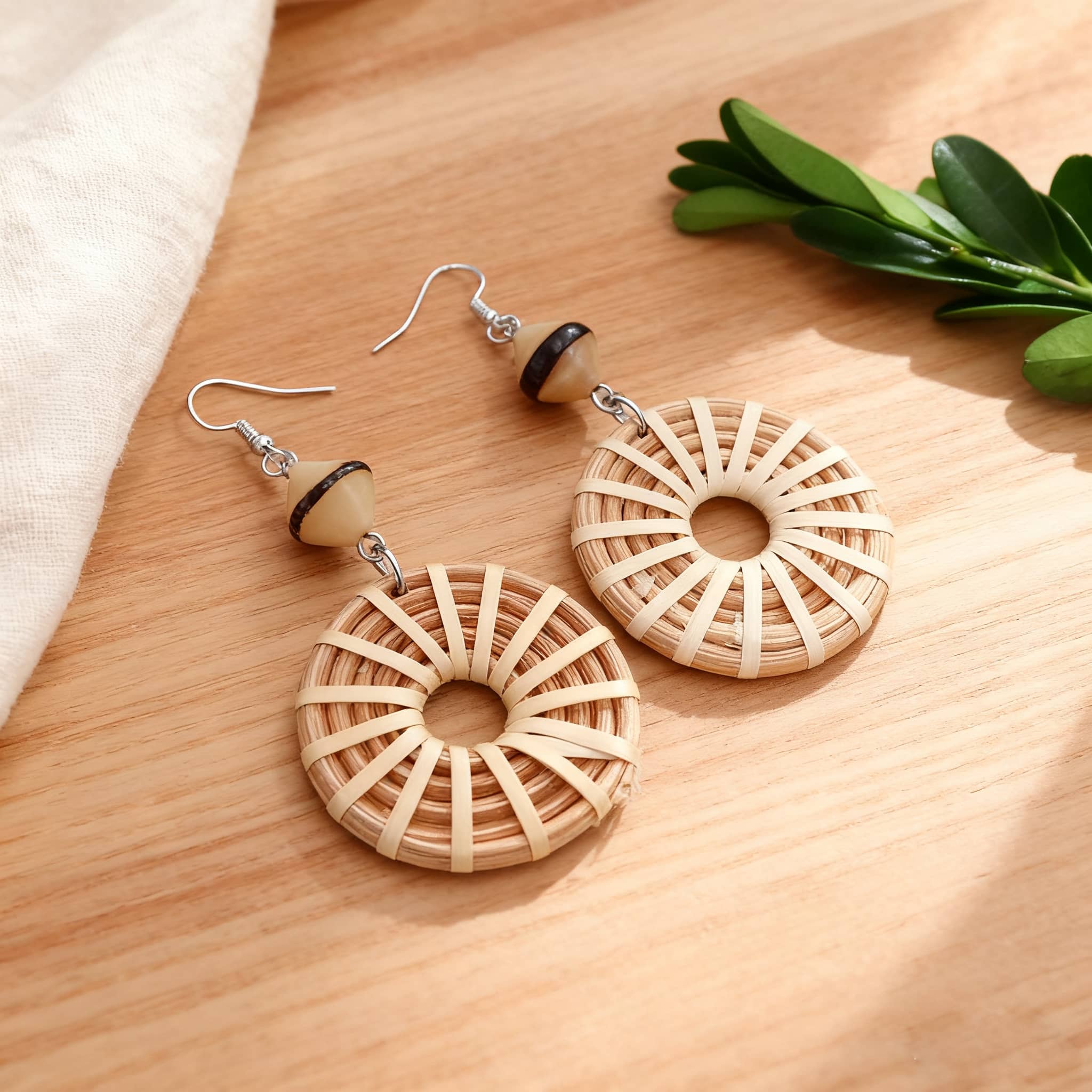 Woven bamboo hoop earrings featuring a unique design for a stylish, natural look