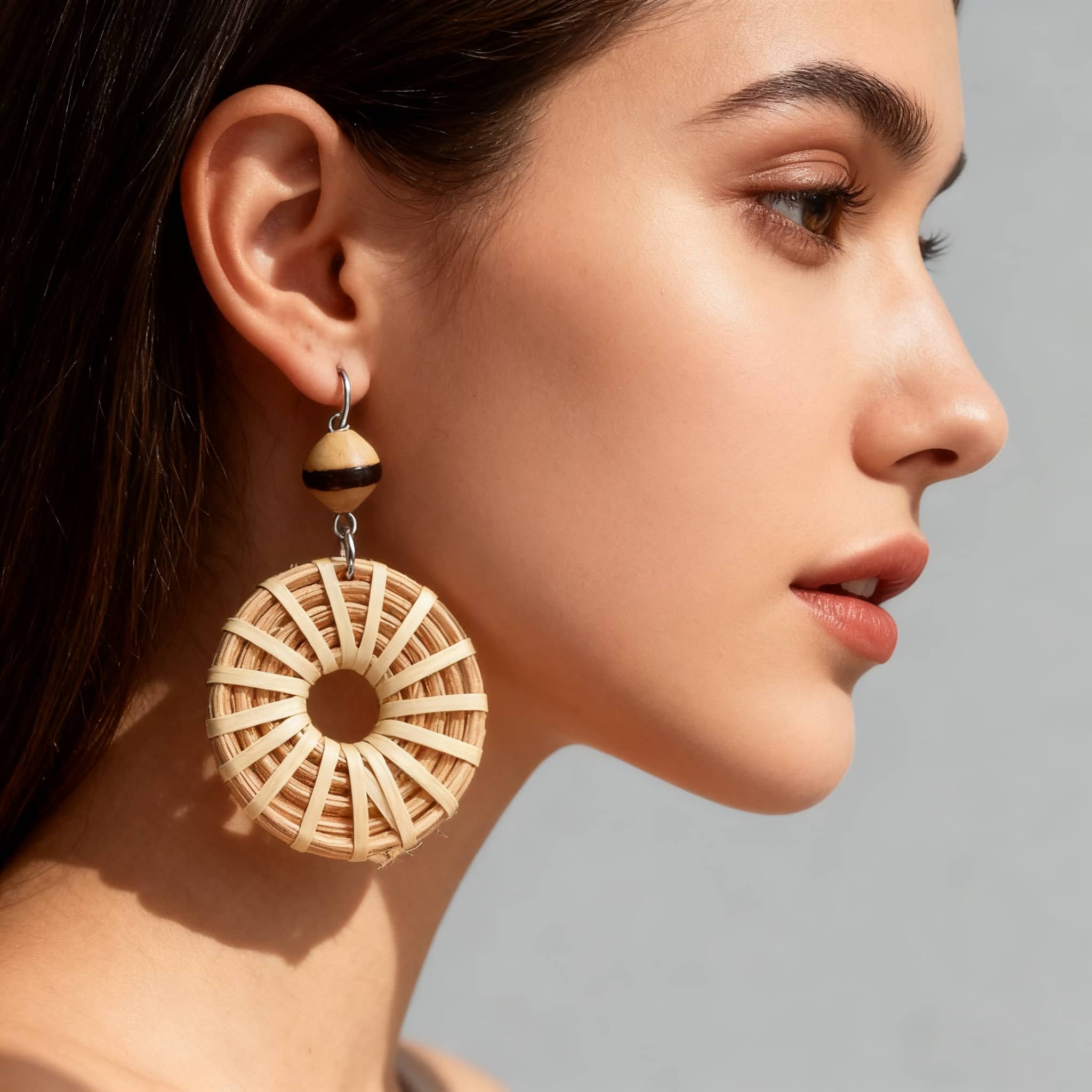 Woven bamboo hoop earrings by 5 Senses with large circular design and stylish accents