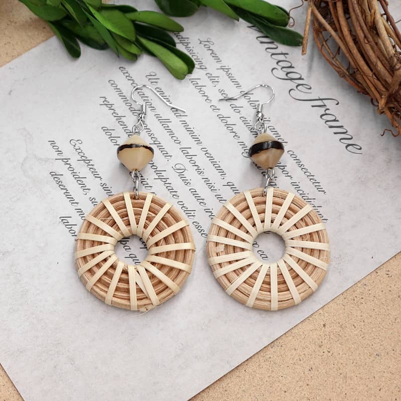 Woven bamboo hoop earrings from 5 Senses with intricate design and natural materials