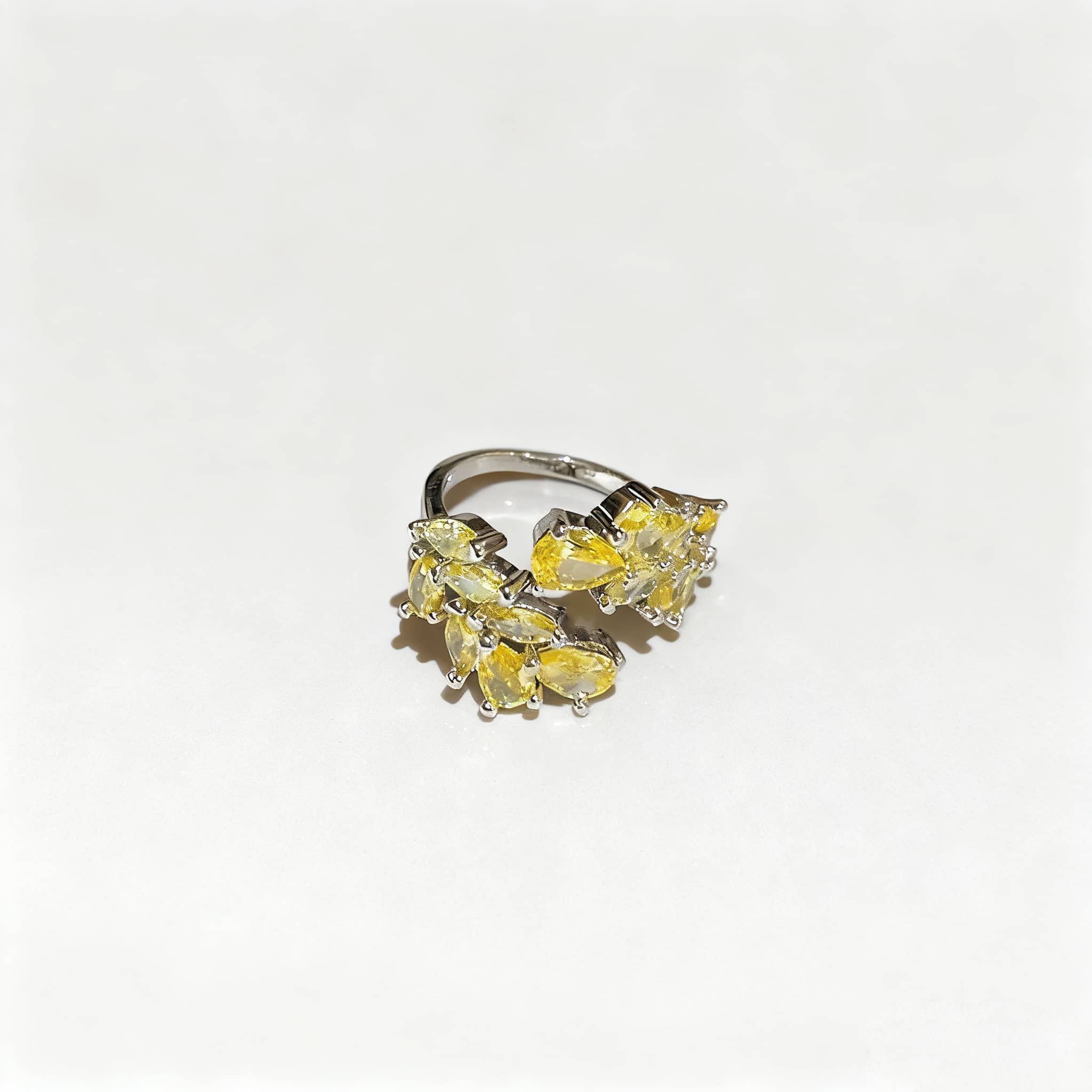 Elegant silver yellow zircon wheat ring featuring a cluster of pear-shaped gemstones