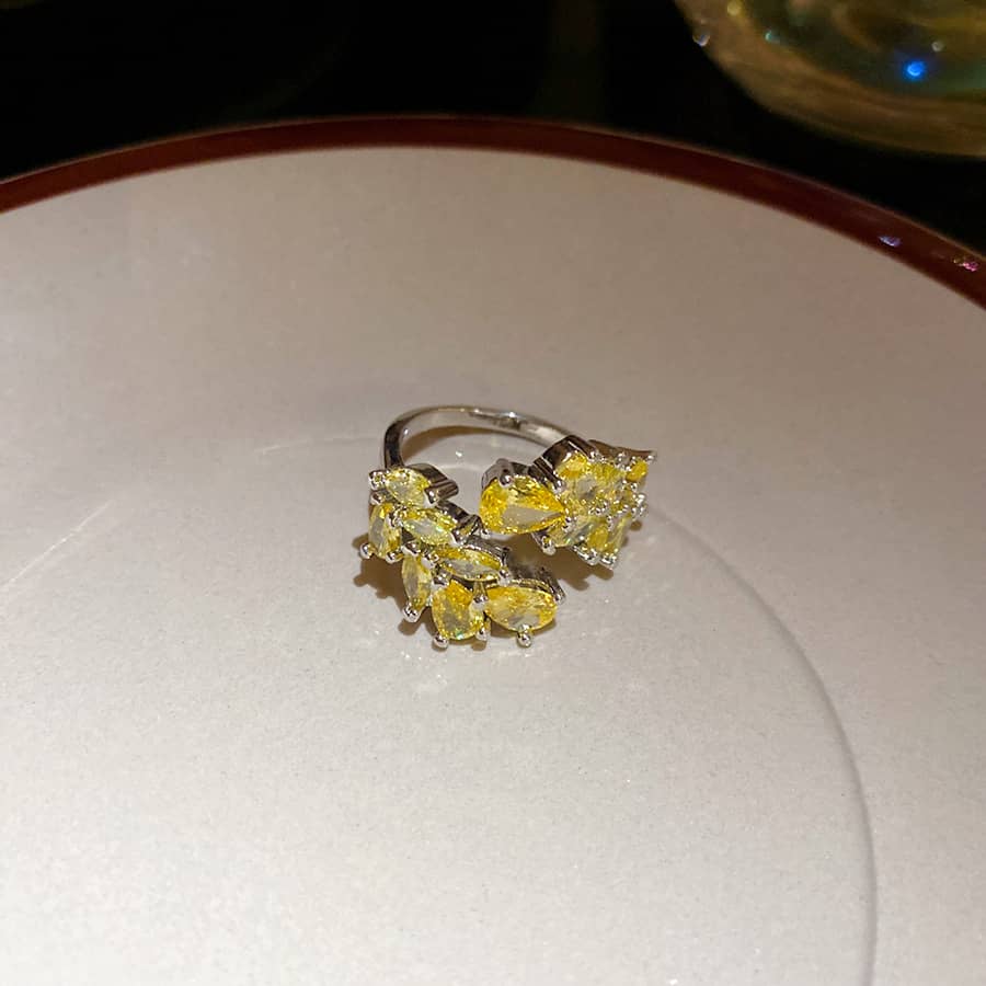 Elegant yellow zircon wheat ring featuring a unique floral design in sterling silver